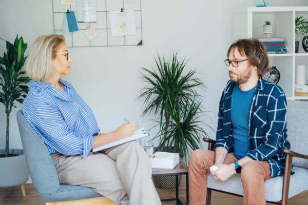 Therapist talking to patient in cognitive behavioral therapy