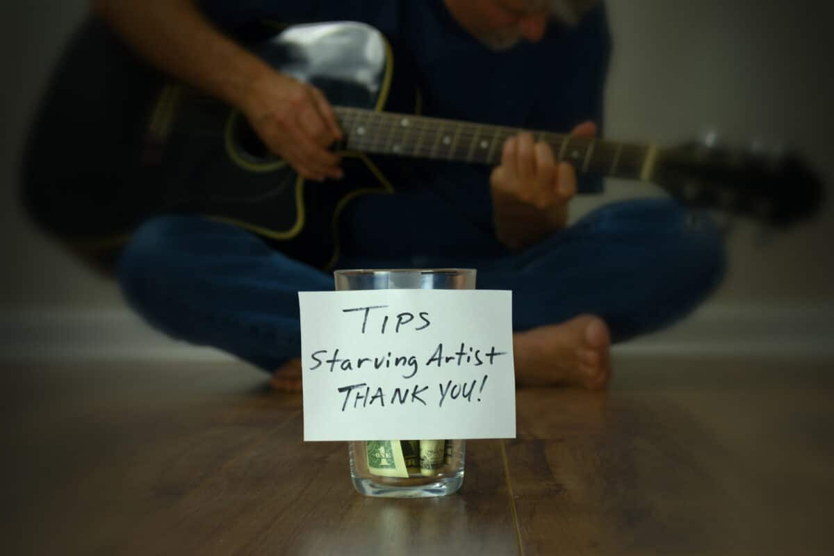 Starving artist with a tip jar