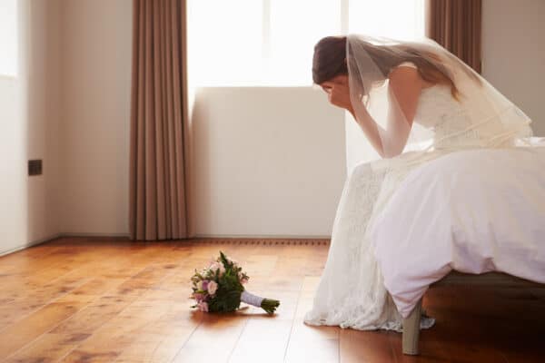 Bride with second thoughts crying on wedding day