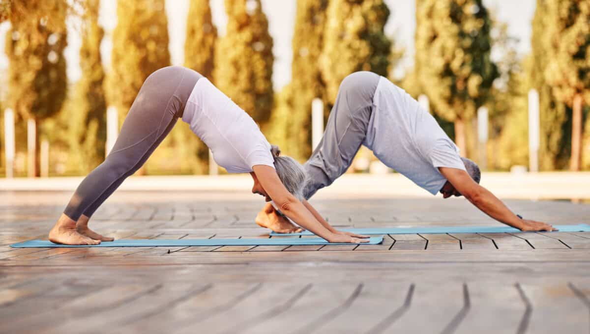 Older couple practicing yoga