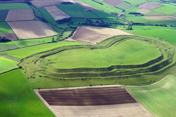 Aerial view of Maiden Castle, Dorset, the largest Iron Age hillfort in Britain.
