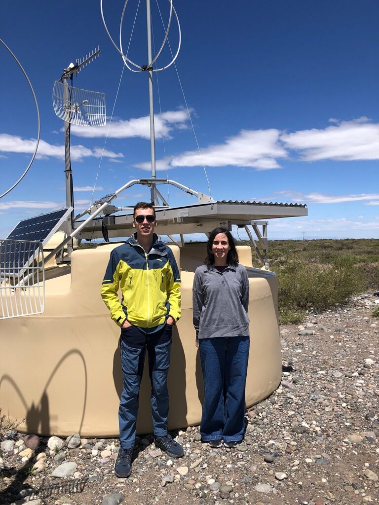 Domenik Ehlert and Foteini Oikonomou in front of one of the 1,600 surface detectors