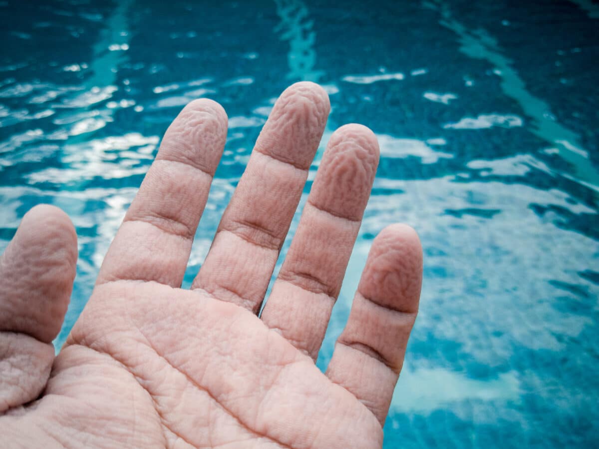 Pruney fingers by a pool