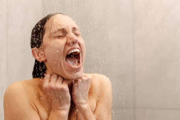 Woman screaming from a cold shower