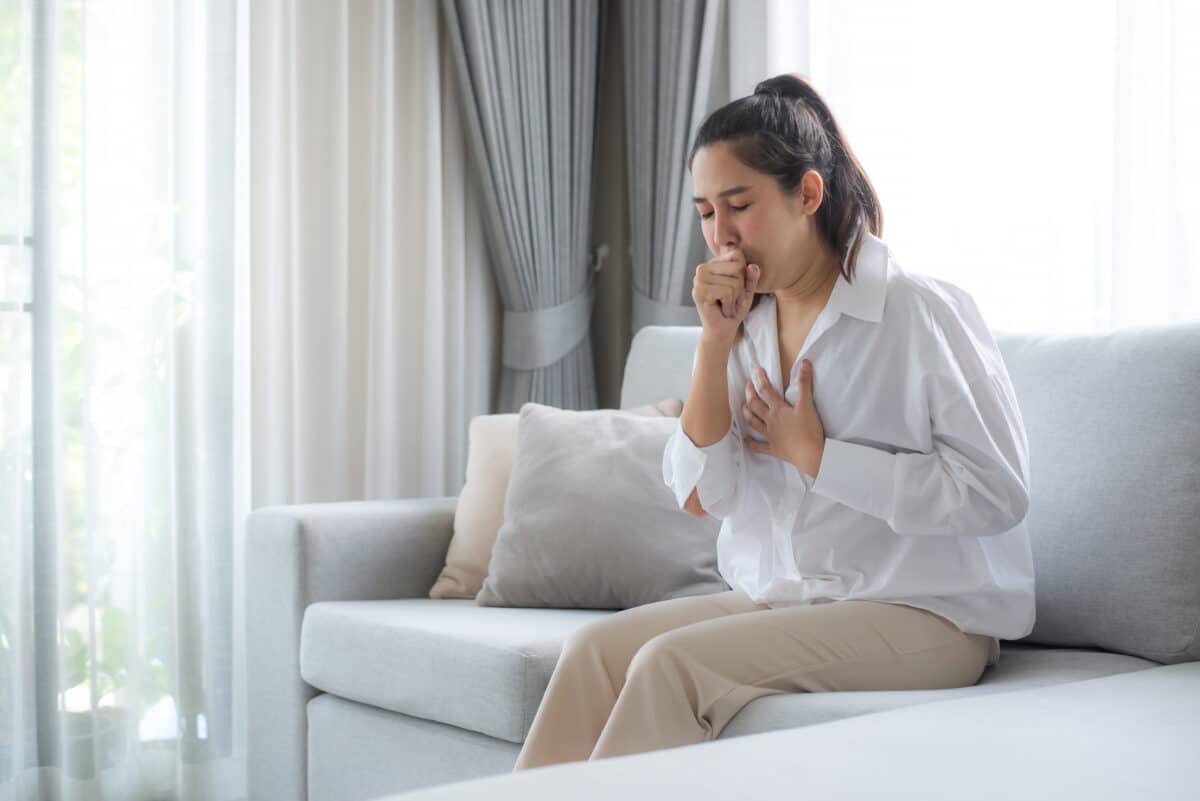 Sick woman coughing