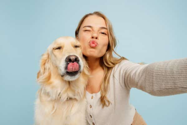 Dog owner and dog posing for a selfie.