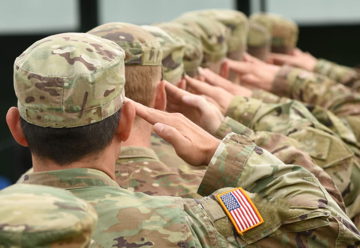 Military personnel saluting