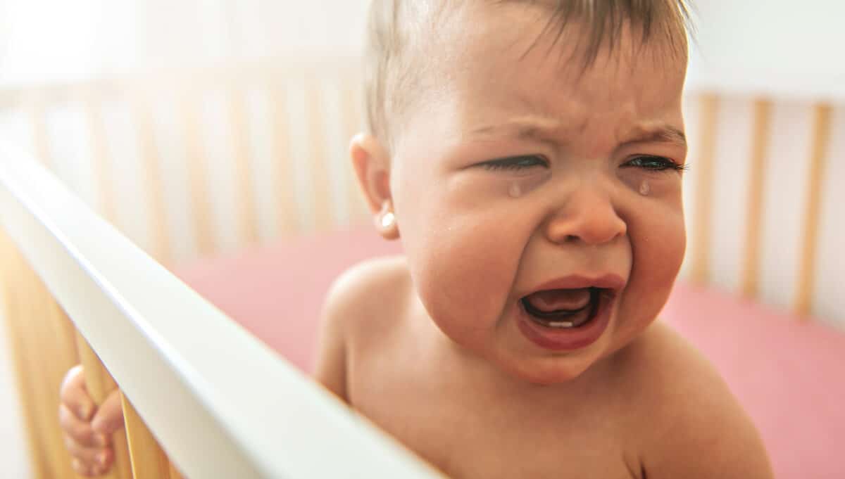 Baby crying in crib