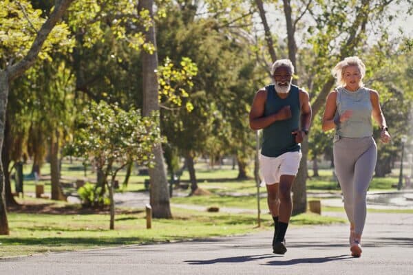 Older couple running outside