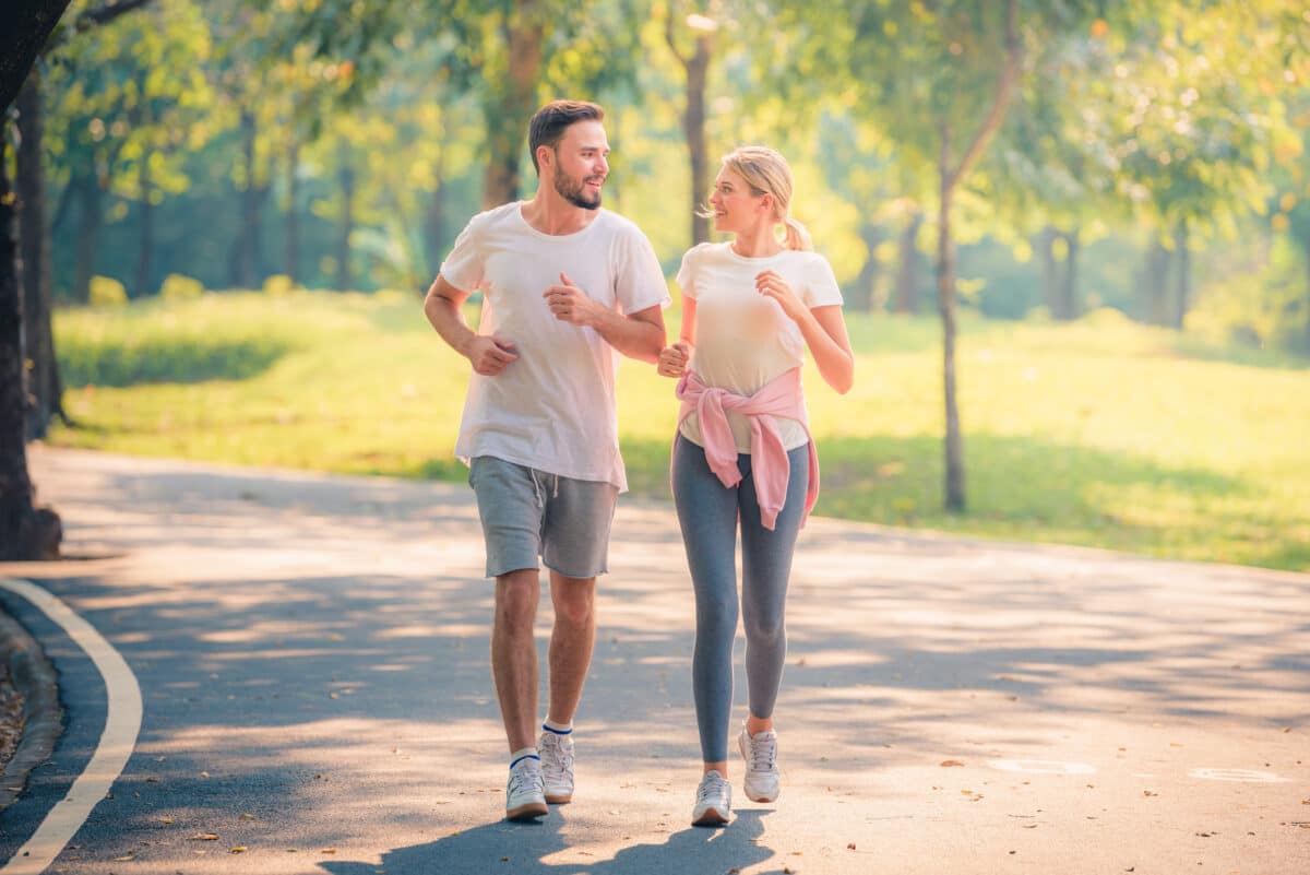 Couple walking or jogging in the park