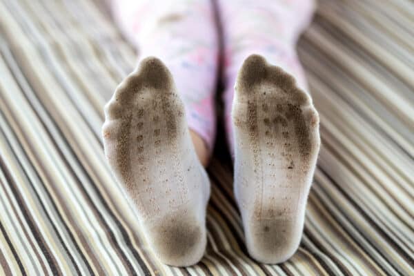 A child's dirty socks and feet