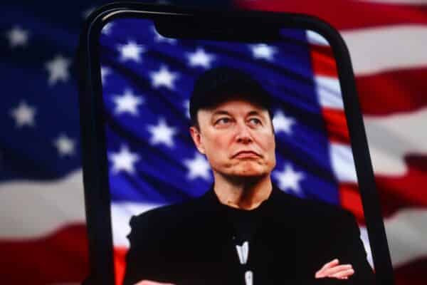 Elon Musk in front of American Flag