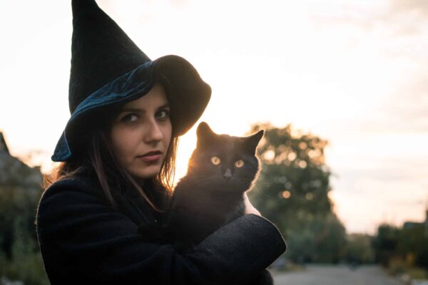 Witch with black cat for Halloween