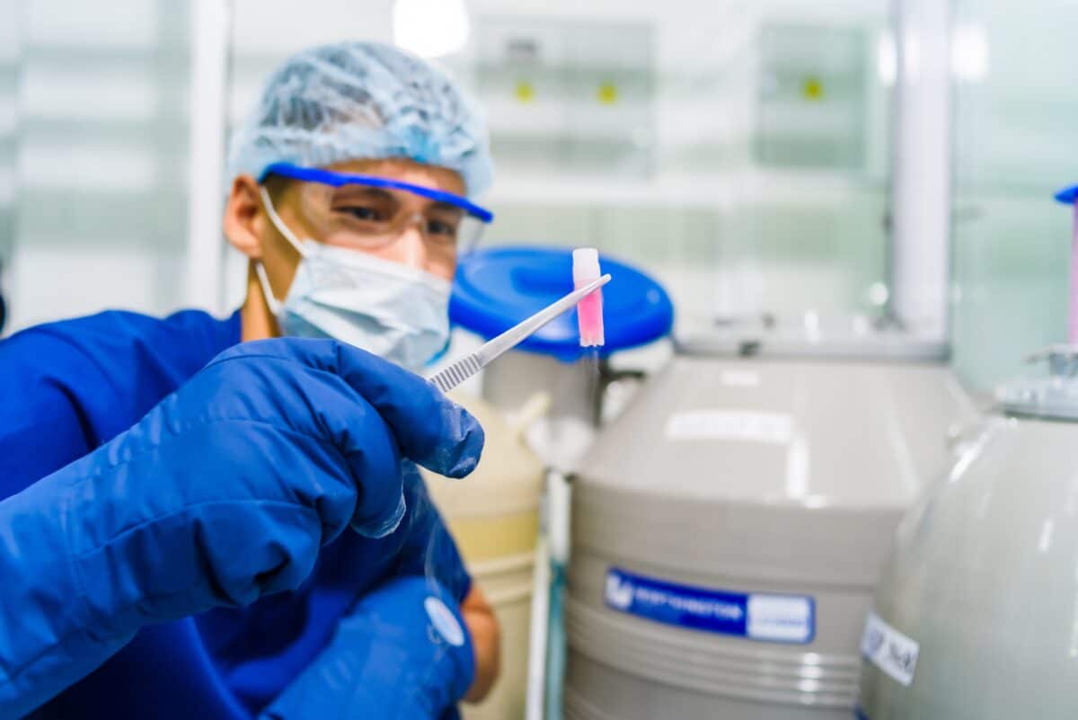A fertility doctor holds a frozen egg in the laboratory at an IVF clinic.