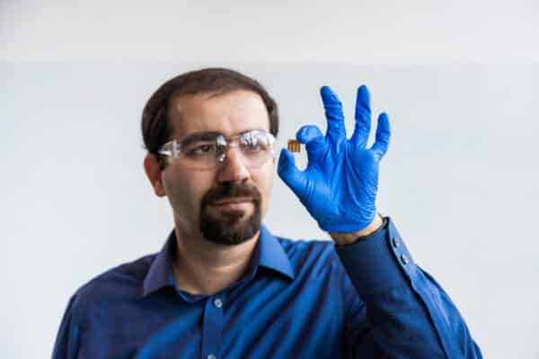 Associate Professor Mojtaba Abdi-Jalebi with a small prototype of photovoltaic cells optimized for indoor light.