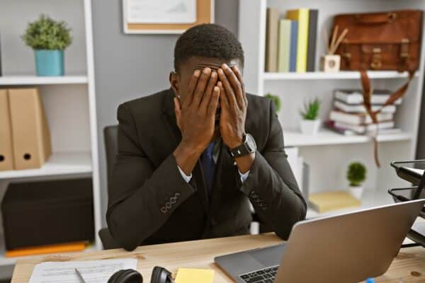 Stressed out man at his work desk
