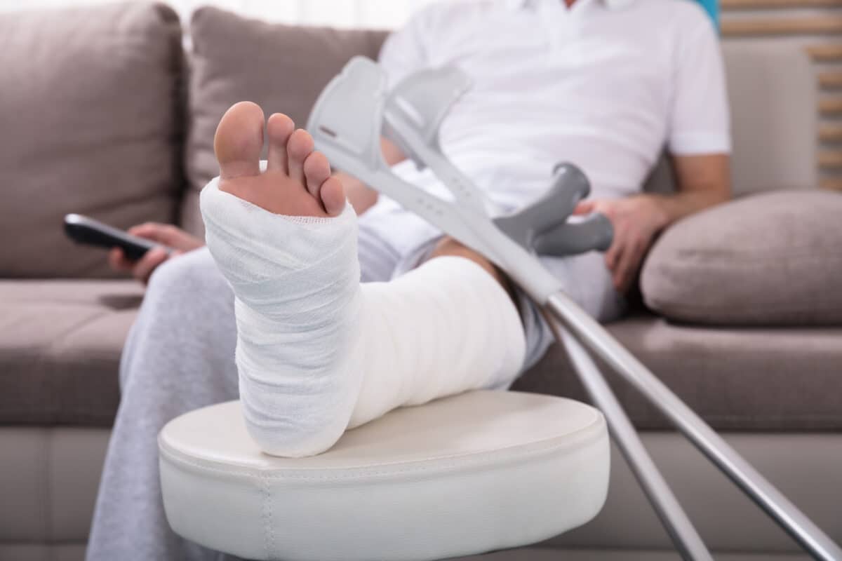 Man with broken leg in cast