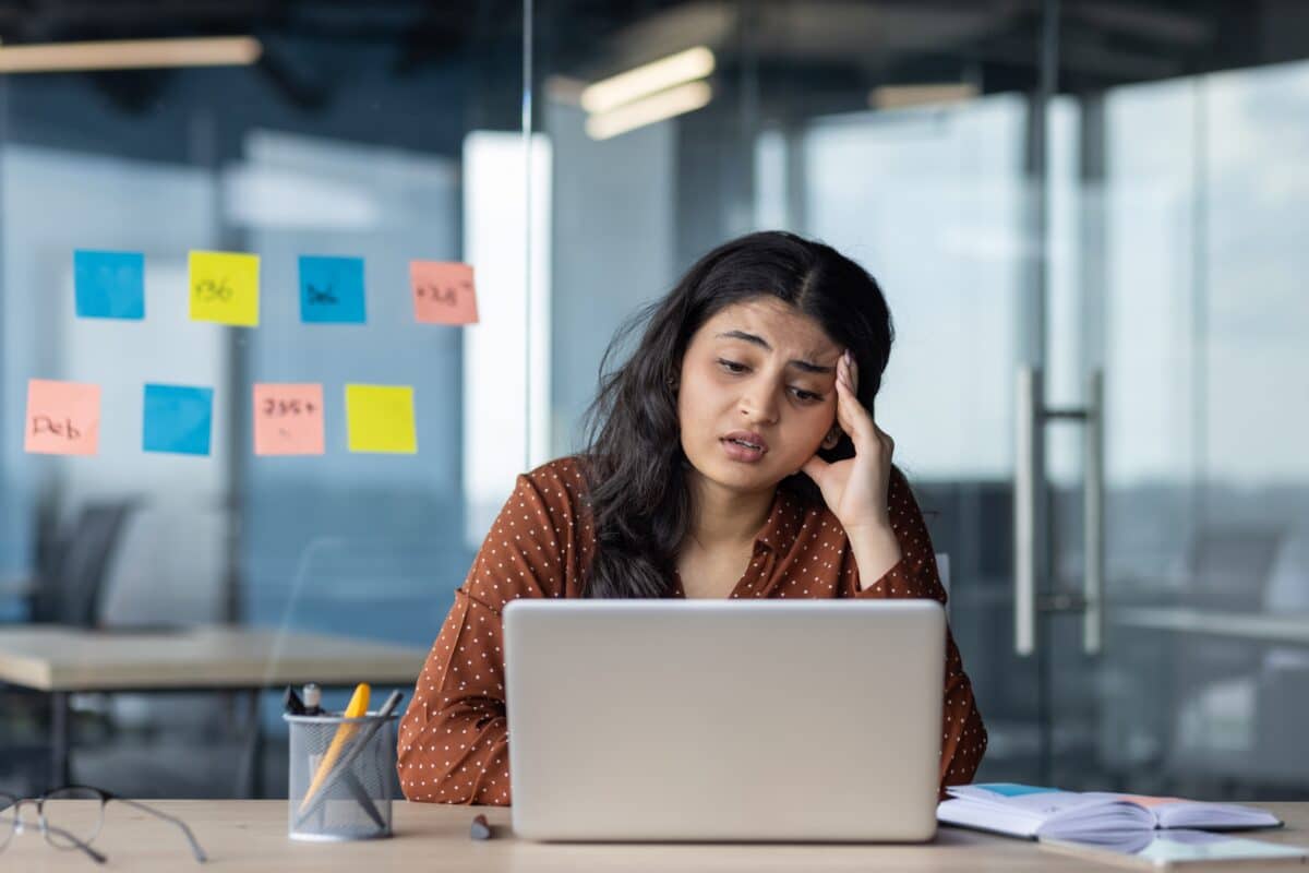 Sad, upset woman at desk