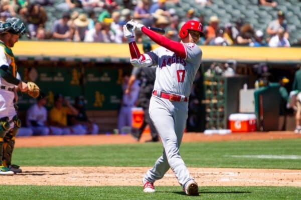 Shohei Ohtani takes a practice swing during a game against the Oakland Athletics at the Oakland Coliseum.