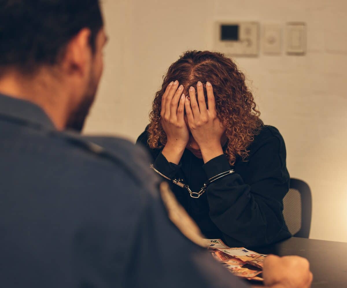 Woman under arrest, interrogated