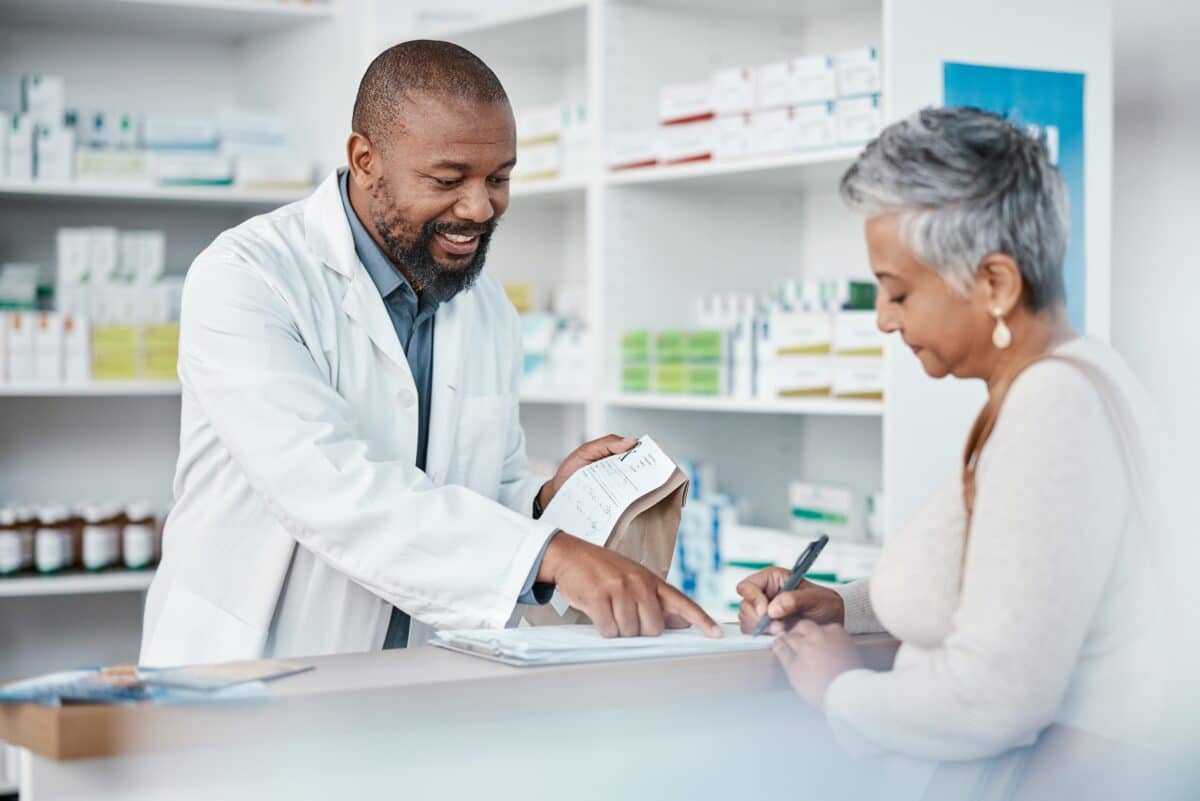 Pharmacist with patient