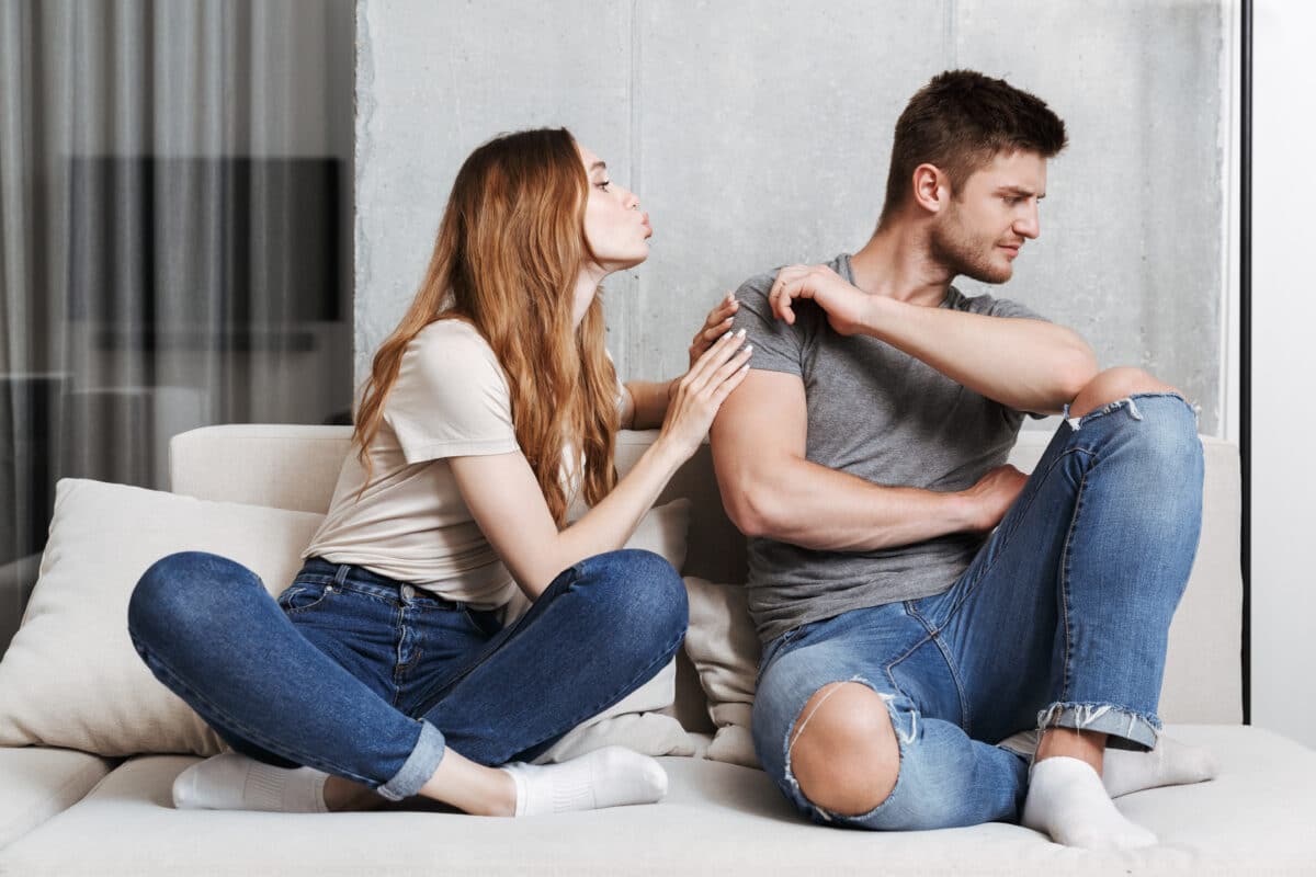 Man rejects a kiss from his girlfriend or partner