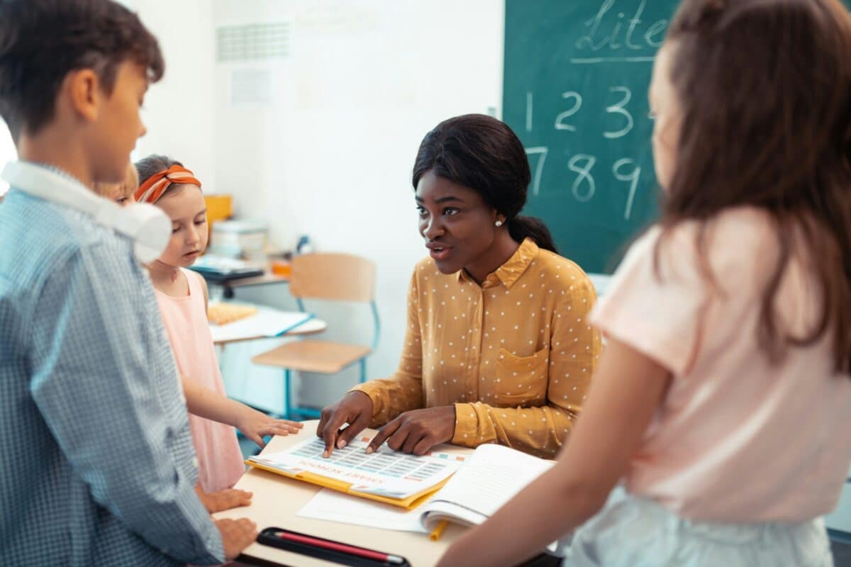 Teacher with young students in the classroom