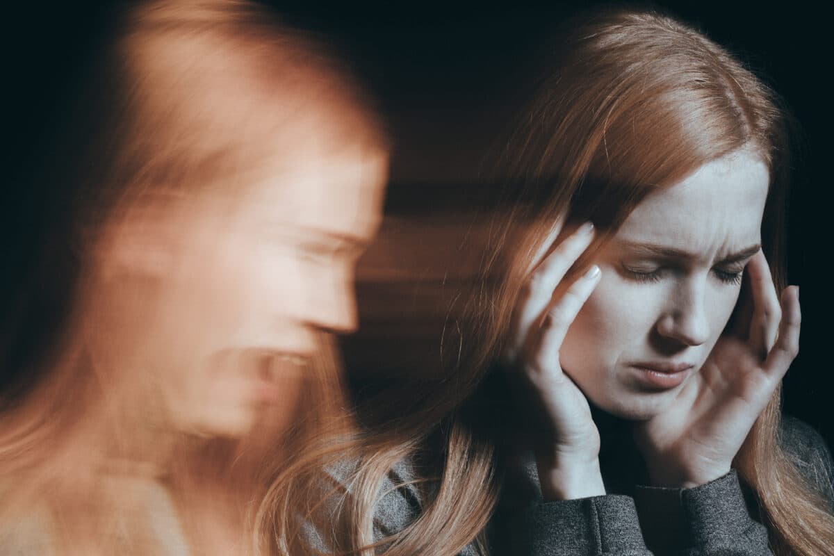 Woman hearing voices or experiencing schizophrenia or psychosis