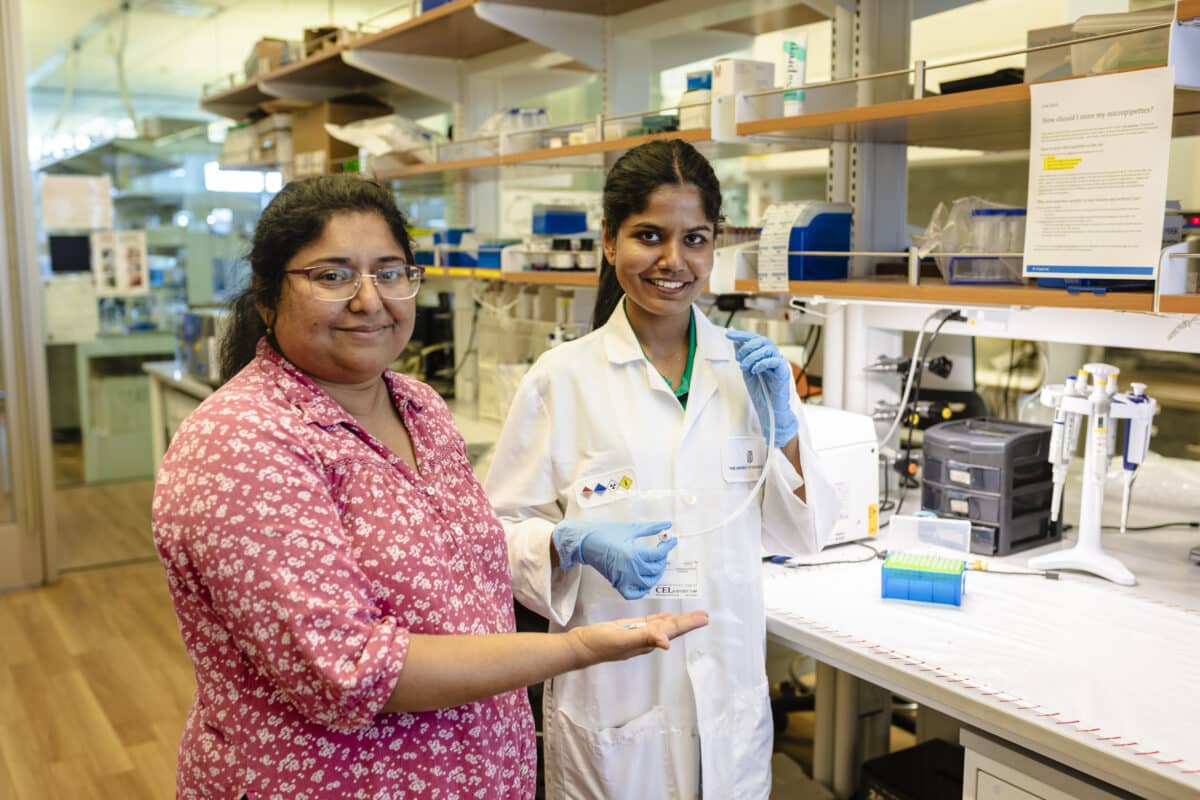 Dr. Shalini Prasad (left) and biomedical engineering doctoral student Nikini Subawickrama show off the electrochemical sensor technology that could lead to a new tool for detecting various thoracic cancers.