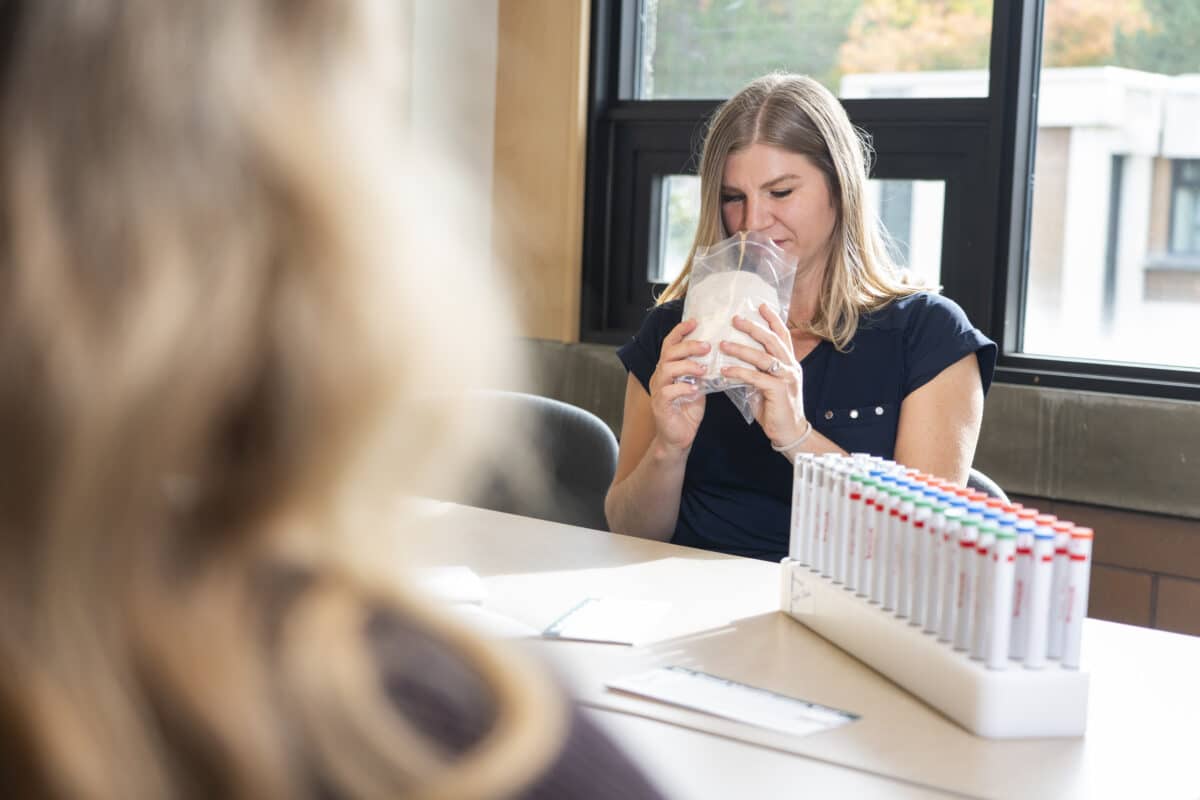 University of Victoria researcher, Marlise Hofer, smells a white undershirt provided to study participants.