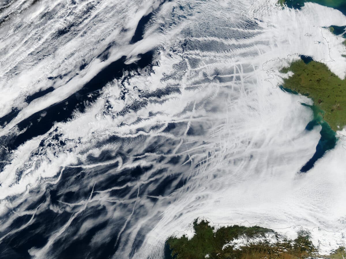 Streaks seen in this satellite image are from ships releasing sulfur dioxide that form sulfate aerosols in the atmosphere. Those aerosols, deemed dangerous to both humanity and the environment, reflect sunlight and make clouds more reflective. Reducing aerosol pollution has resulted in less sunlight reflection, accelerating warming.