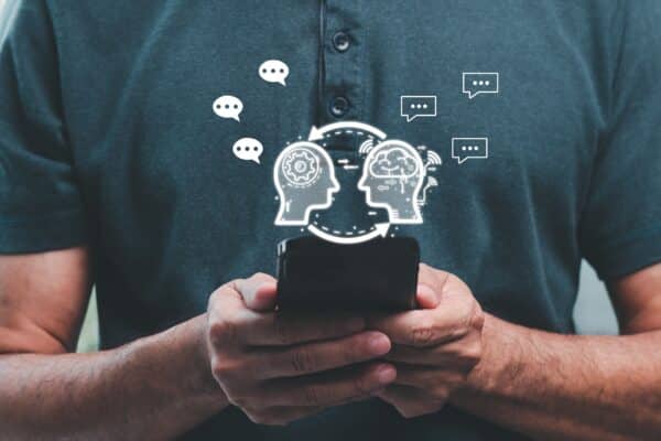 Man on phone using AI