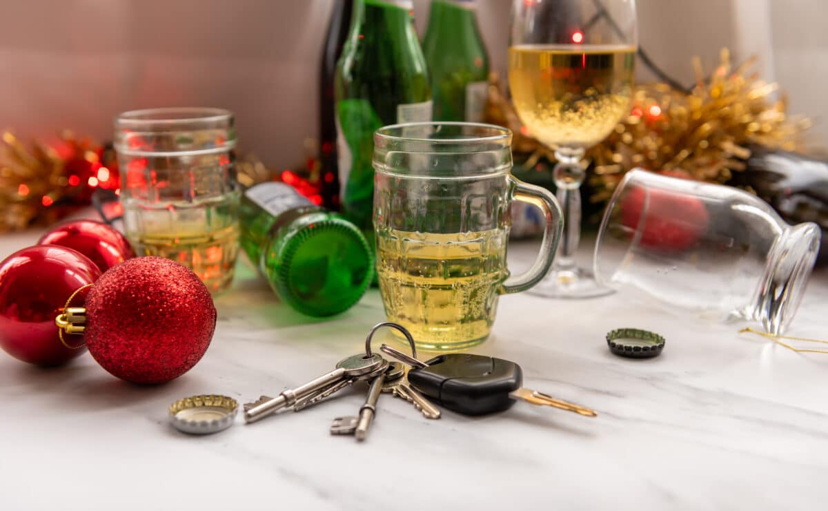 Car keys in front of Christmas holiday party drinks