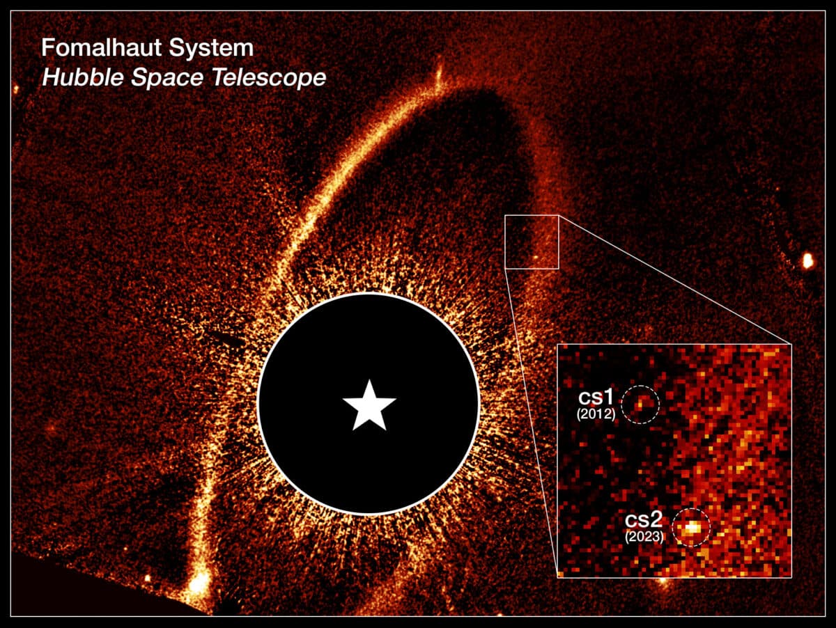 This composite Hubble Space Telescope image shows the debris ring and dust clouds cs1 and cs2 around the star Fomalhaut.