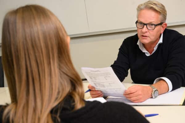 A negotiator speaking with his counterpart.