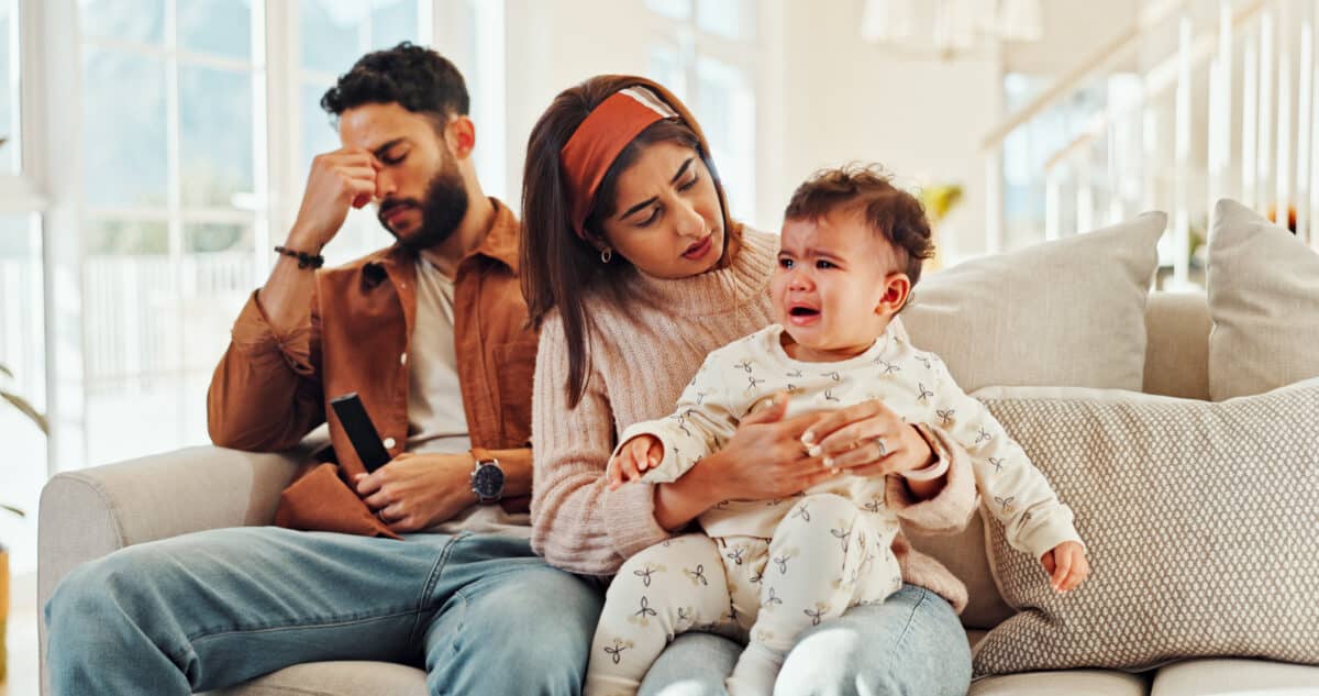 Young parents stressed out over crying baby