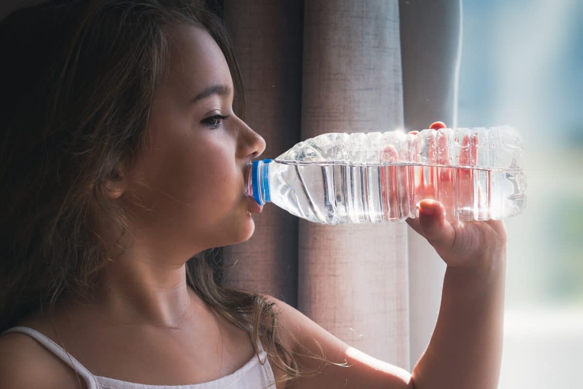 Child drinks bottled water