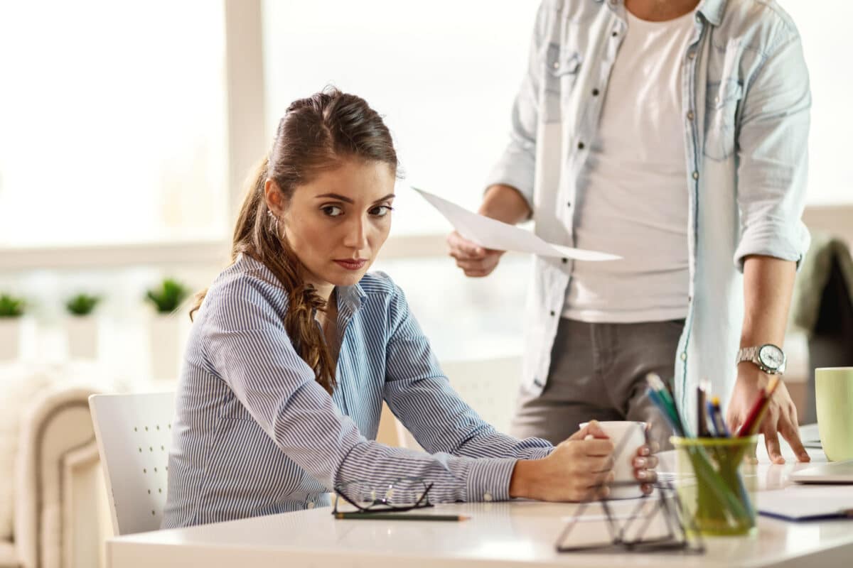 Woman upset after being reprimanded by boss at work