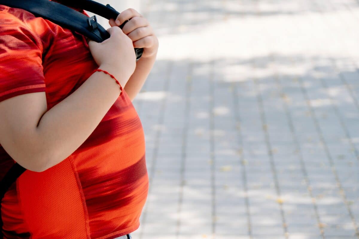 Childhood,Obesity,Concept.,Boy,With,School,Bag,With,Big,Belly.