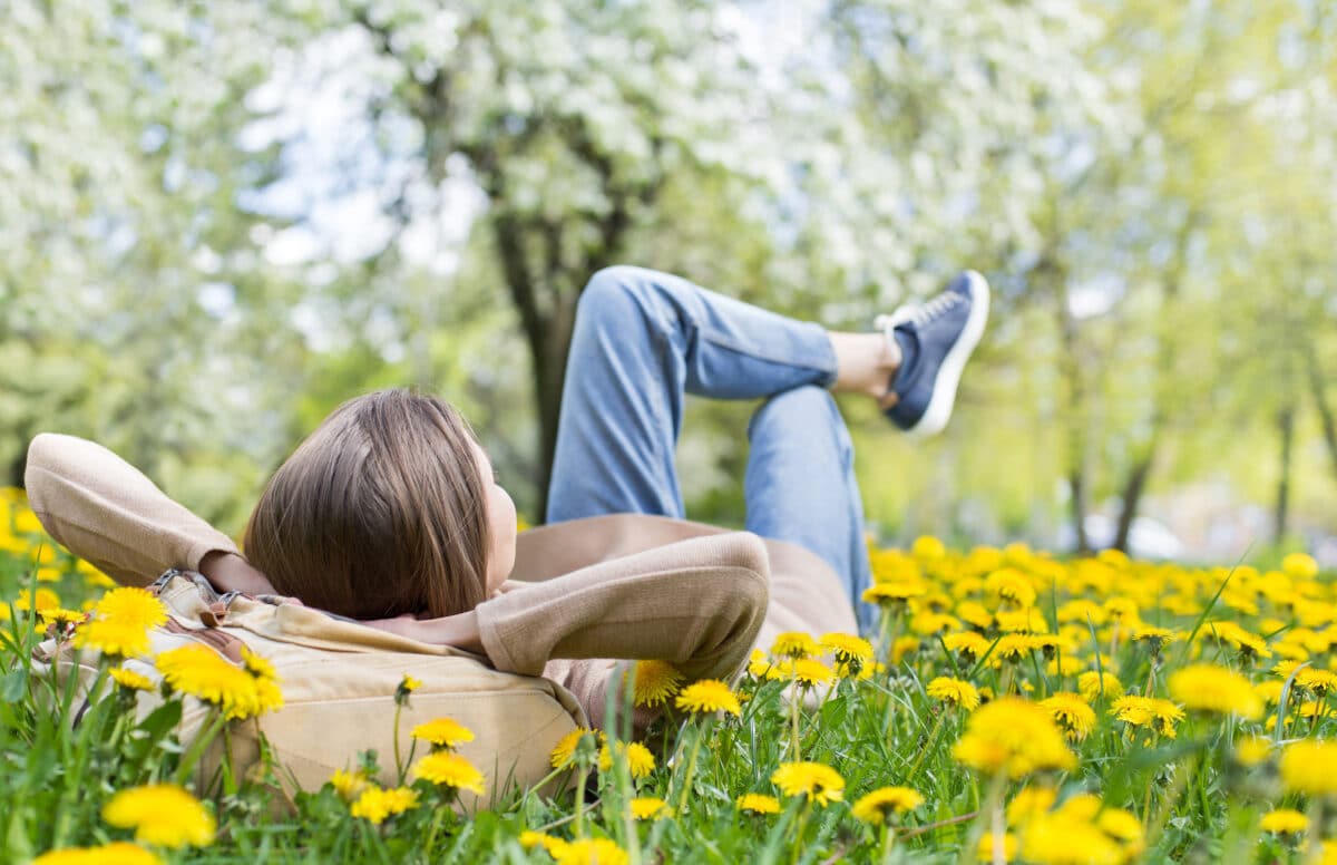 Relaxing,Woman,Lying,On,Spring,Blooming,Meadow.,Girl,Resting,In