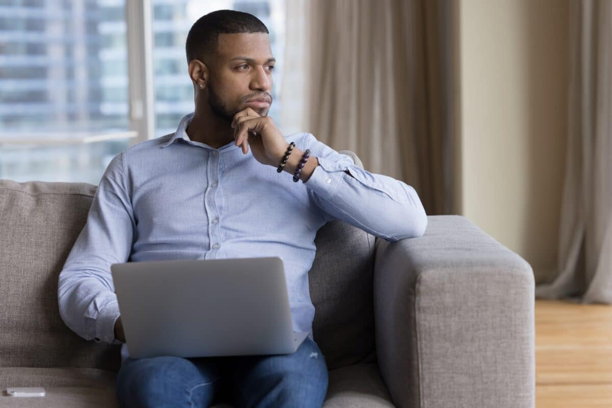 Pensive,African,Guy,Deep,In,Thoughts,,Ponders,,Thinks,Seated,On