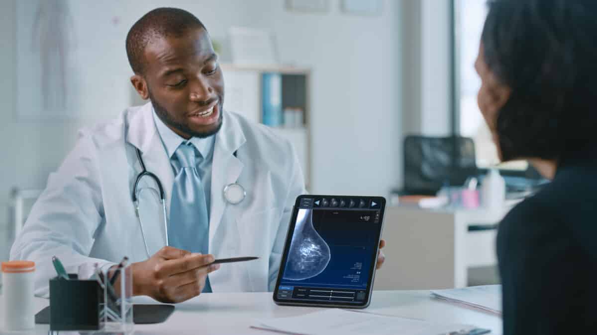 Doctor discussing mammogram with breast cancer patient