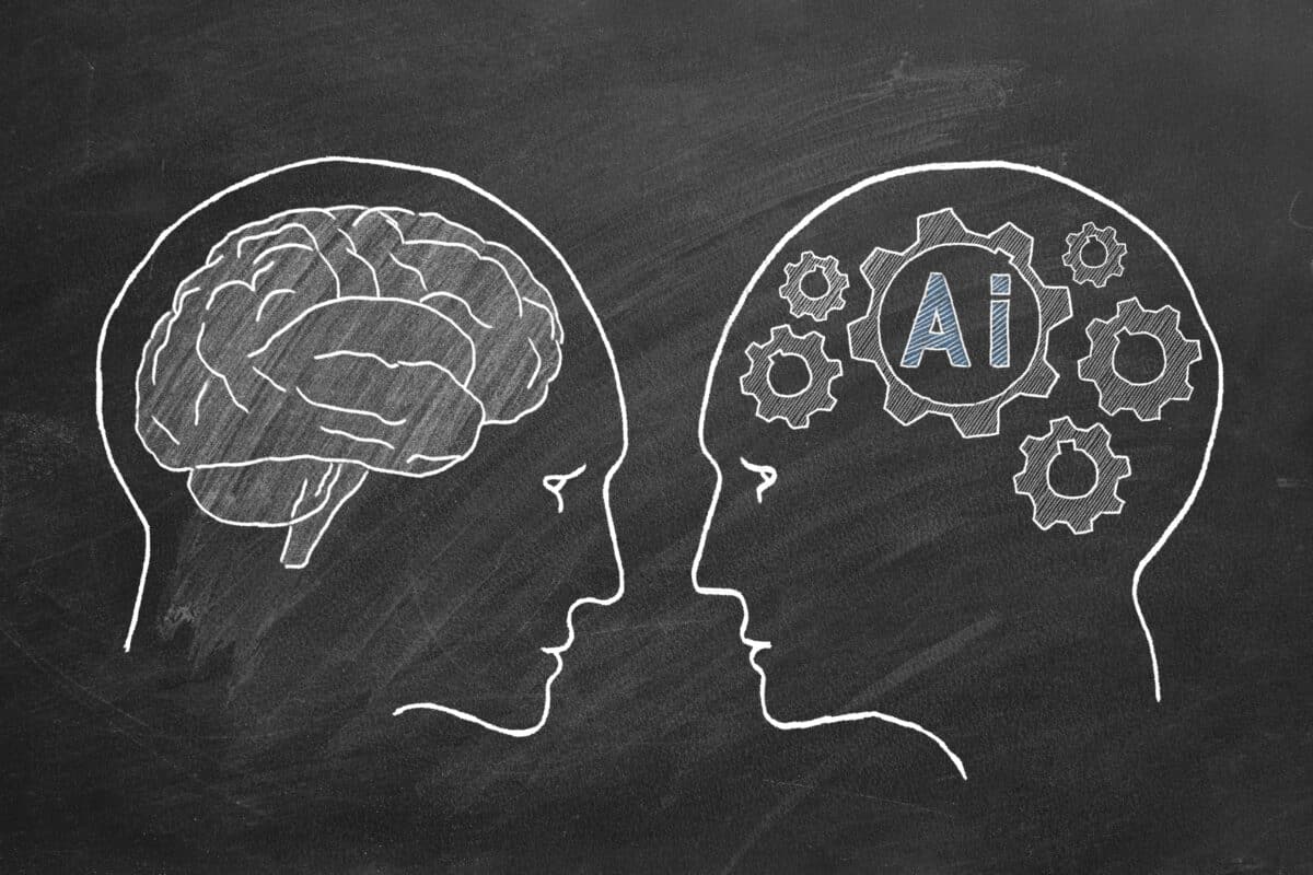 Sketch of a human brain and an AI brain on a blackboard