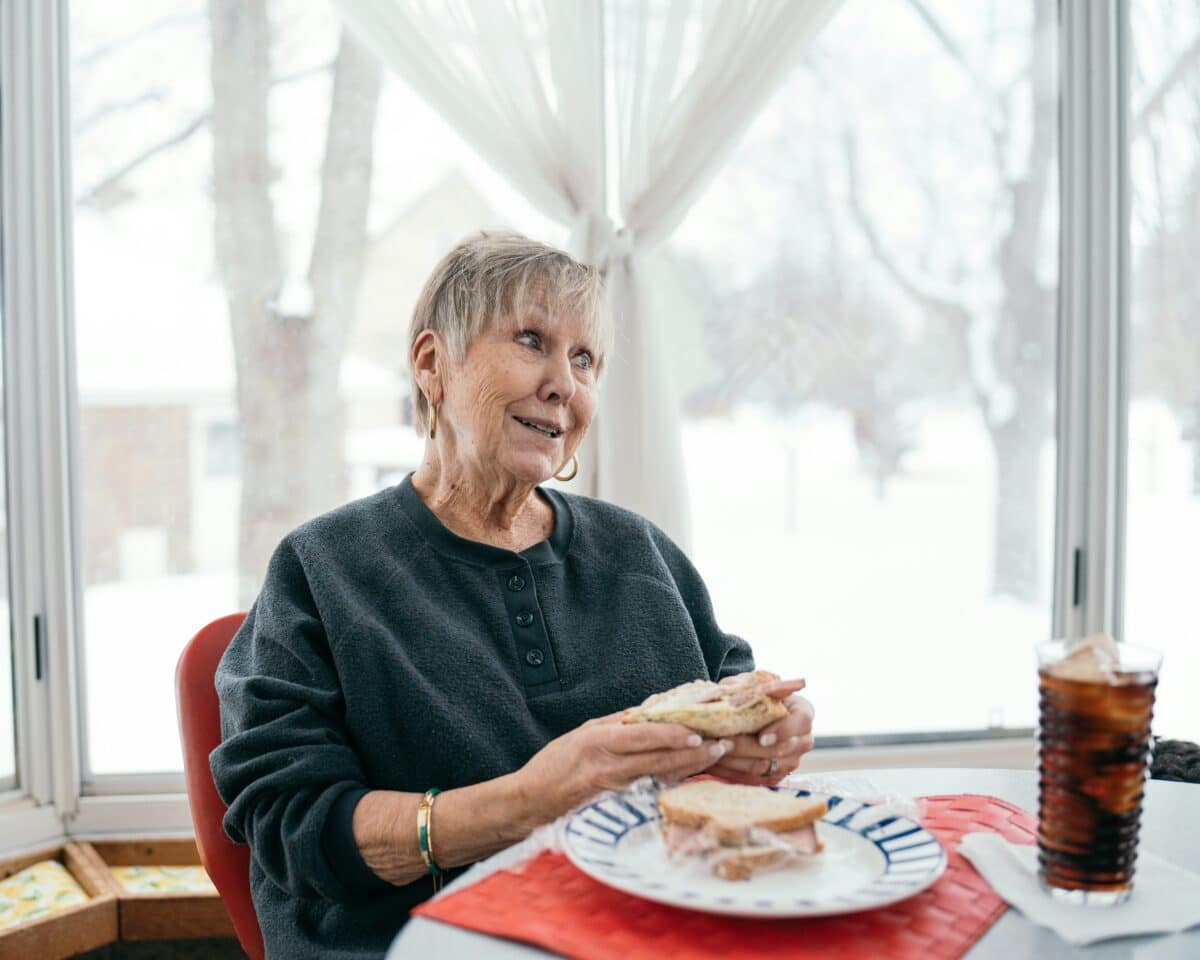 woman eating meat