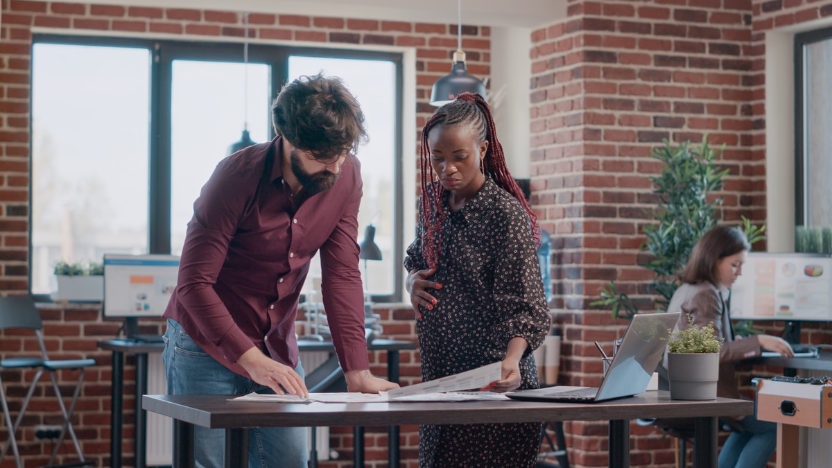 Black Pregnant Worker in Office