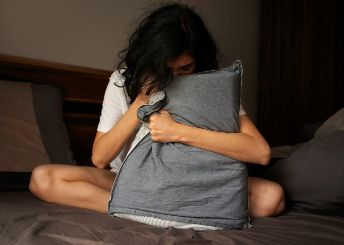 Lonely or depressed woman in bed