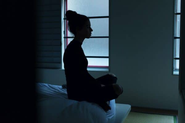 Woman can't sleep from insomnia or stress