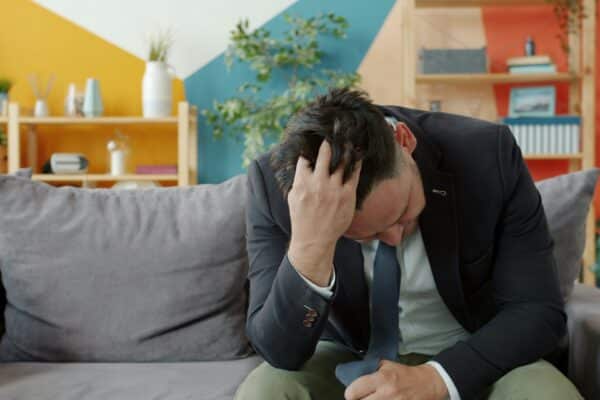 man stressed money