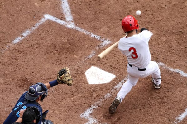 Batter Swings, catcher and ump ready
