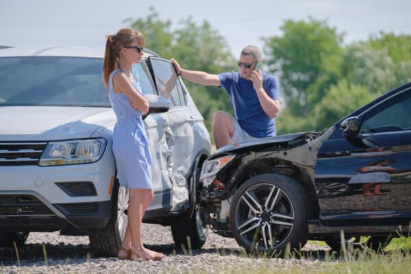 Drivers in a car crash call for help after accident